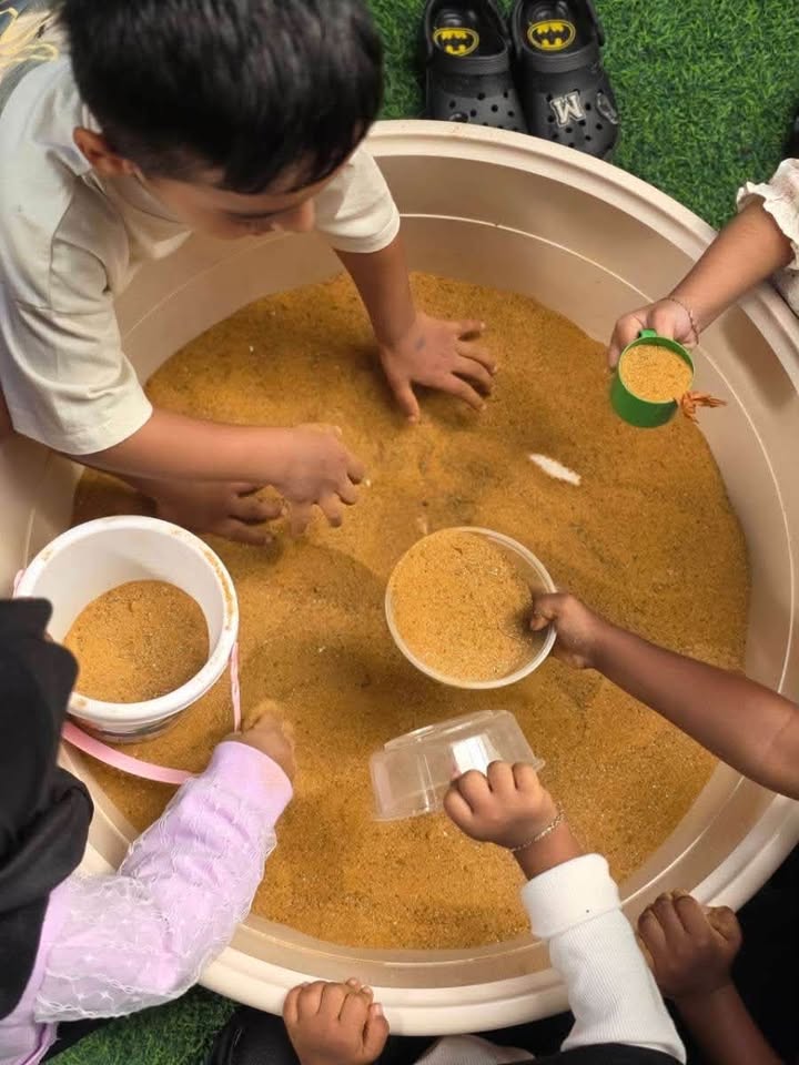 Baby Club little learners explore full and empty through hands-on measuring activities