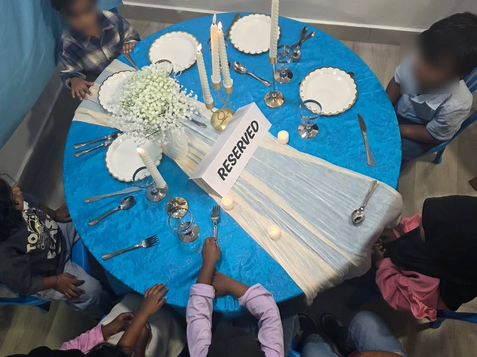 Students develop essential self-feeding skills through everyday mealtimes together